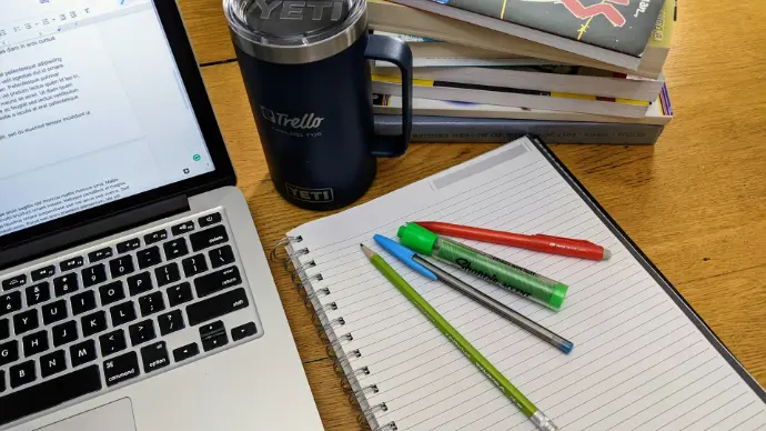 a laptop and a cup of coffee